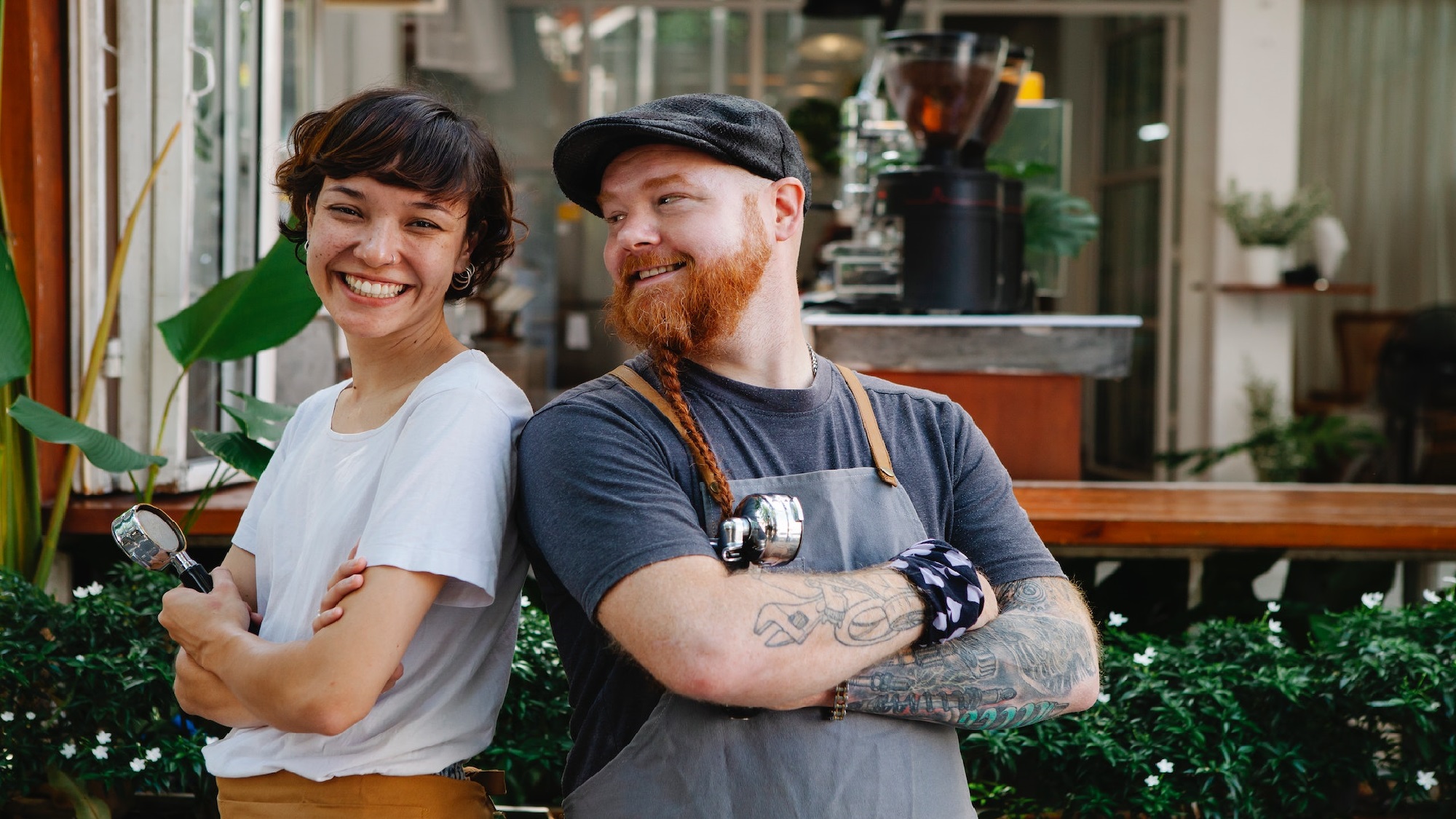 Couple sitting together on couch looking at laptop